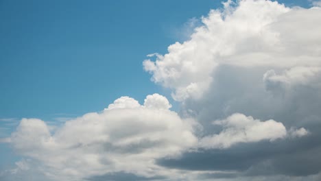 timelapse of cumulus clouds moving left to right forming fluffy clouds in blue skies over thailand