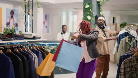 Couple-having-fun-in-clothing-store