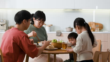 family dinner in modern kitchen