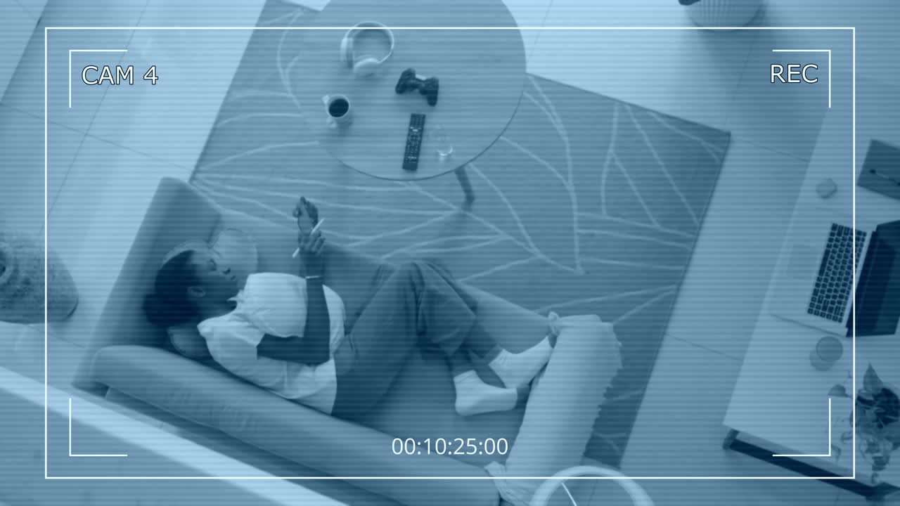Top View of Black Woman Resting on Sofa with Tablet PC CCTV