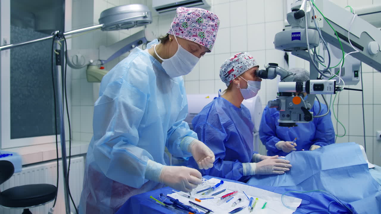 Treatment of cataract and diopter correction. Doctor using microscope during eye surgery process