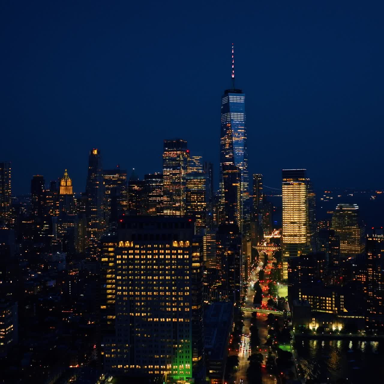 Stunning New York scenery at night. Drone footage rising above the cityscape with billions of lights