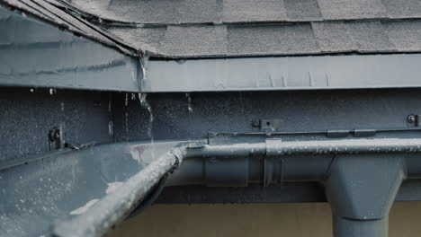Rain-drain-into-gutters-on-the-roof-of-the-house-2