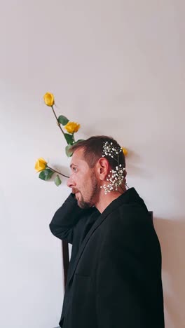 man with yellow roses and white flowers