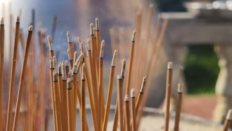 burning incense sticks at a temple