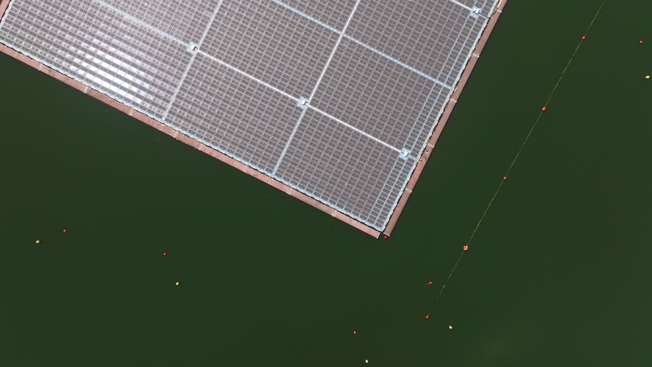Flying over large Floating Solar Farm on Portugal's largest artificial lake