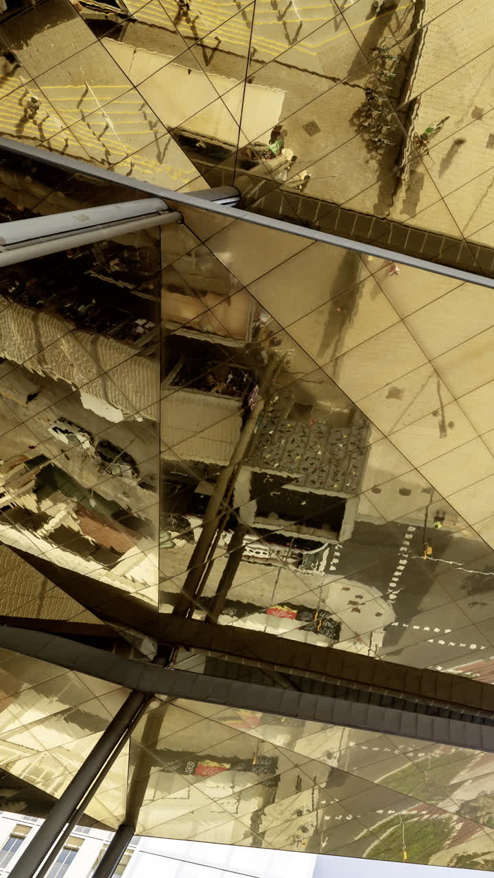Timelapse of the encants second hand market with gloden reflecting roof in barcelona in vertical