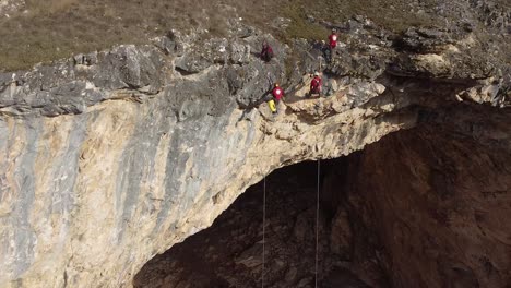 emergency team securing the terrain above a massive cave