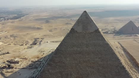 aerial of the iconic great pyramids of giza and the sprawling pyramids plateau in egypt, epitomizes the concept of ancient marvels and timeless cultural heritage