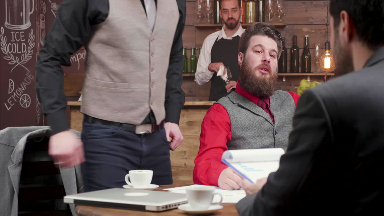 Business meeting in a cafe with coffee service