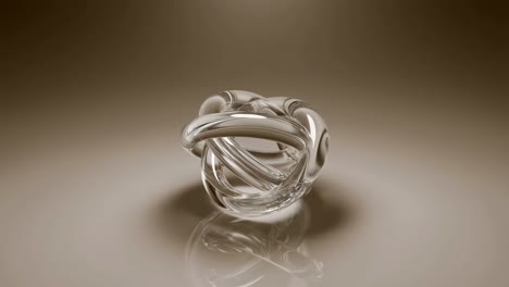 abstract transparent knot sculpture on reflective surface