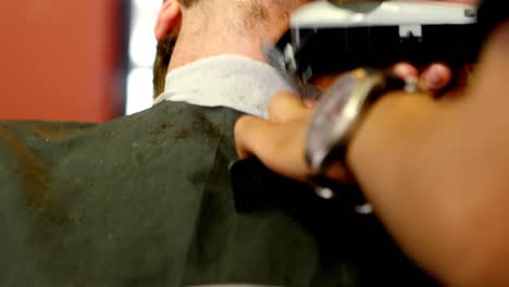 Man-getting-his-mustache-trimmed-by-trimmer-4k