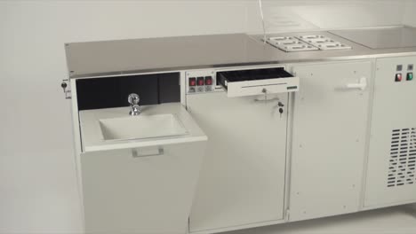 commercial food service cart with sink and cash drawer