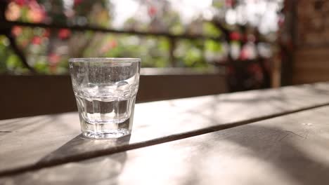 a glass of water on a table