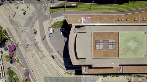 busy road and a school building drone shot,