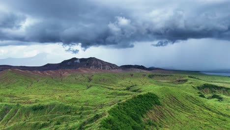 dramatic aerial view of a volcano with stormy clouds