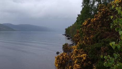 flythrough droneshot by scottish lakeside