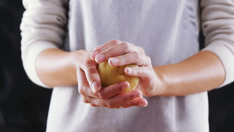 woman molding a dough ball 4k