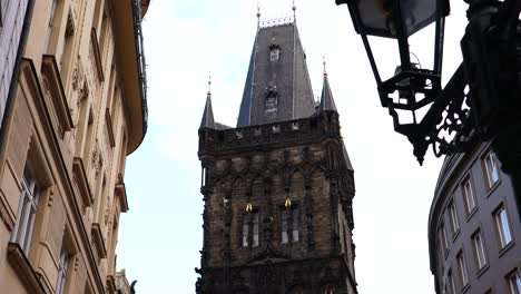 slow pan of gothic architecture powder gate near buildings and lantern