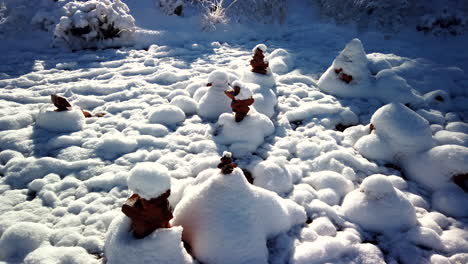 Cairns-covered-by-snow-at-Bell-Rock-in-Sedona,-Arizona