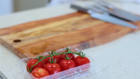a sequence showing tomatoes on a cutting board in a kitchen setting with natural lighting