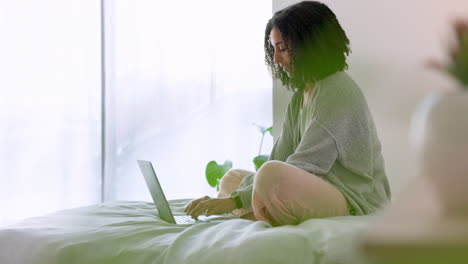 Laptop,-bedroom-and-morning-with-a-woman-typing