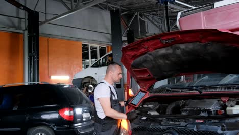 mechanic working on a car in an auto repair shop