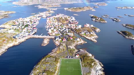 Aerial-footage-over-very-special-football-soccer-field-located-on-a-lonely-island-in-northern-Norway-Lofoten