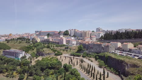 Aerial-drone-shot-of-a-park-in-Casal-Ventoso,-a-formerly-dangerous-neighborhood-in-Lisbon,-Portugal