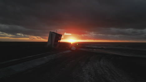 sunset over nci watchtower during stormy weather in winter