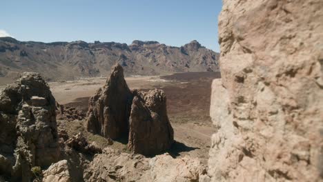 Panoramic-view-on-a-sharp-volcanic-rocky-landscape,-Los-Roques-de-Garcia,-Teide-National-Park-in-Tenerife,-Canary-Islands-in-spring