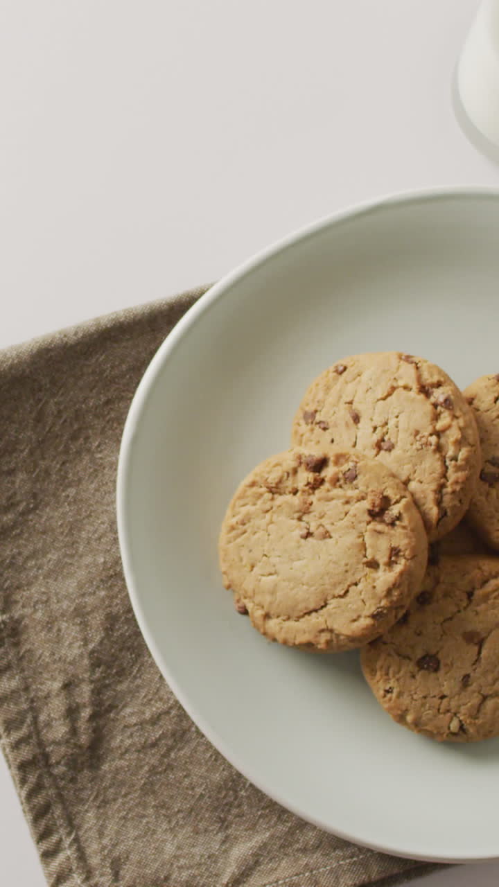 Video of biscuits with chocolate and milk on white background