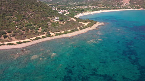 View-Of-The-Mediterranean-Coast-Of-Sardinia-And-The-Blue-Waters-Of-The-Sea-During-Summer-In-Sardinia,-Italy---aerial-drone,-wide-shot