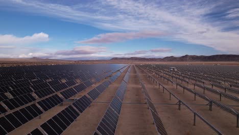 Aerial-Drone-Footage-of-Solar-Panel-Field-in-Joshua-Tree-National-Park-on-a-Sunny-Day,-horizontal-moving-shot