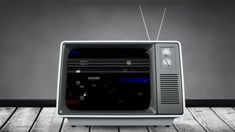 Televison-with-flickering-screen-against-grey-background