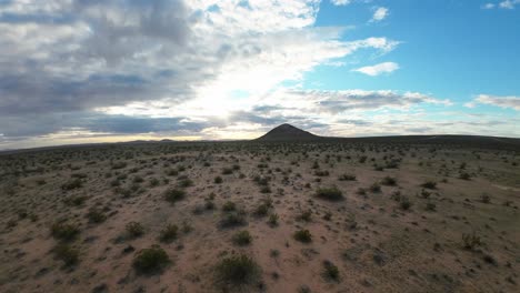 A-highspeed-flight-in-the-Mojave-Desert-basin-towards-a-cone-shaped-dormant-volcano