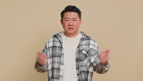 angry asian man asking why what reason of failure irritation disbelief by troubles conflict quarrel