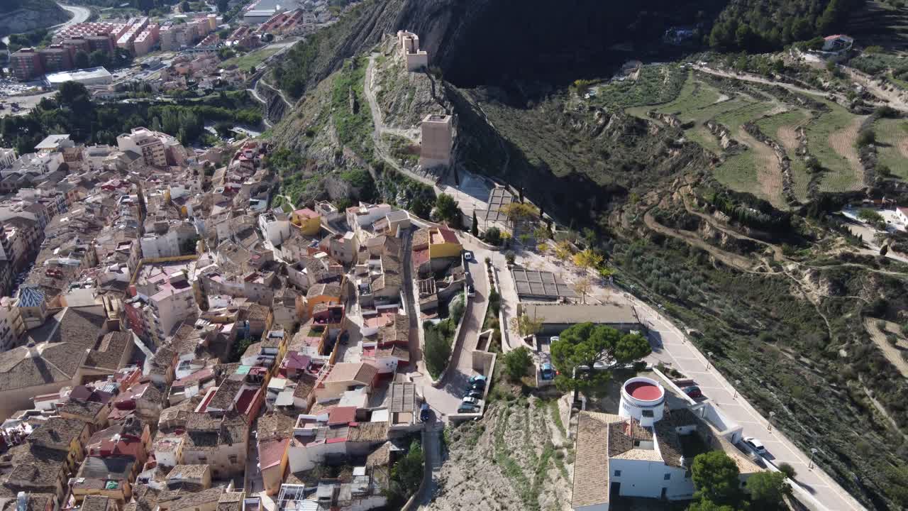 Aerial reveal of the castle, Blay tower and village of Jijona, Spain