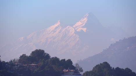 a closeup view of a snow covered mountain in the himalaya mountain range in nepal