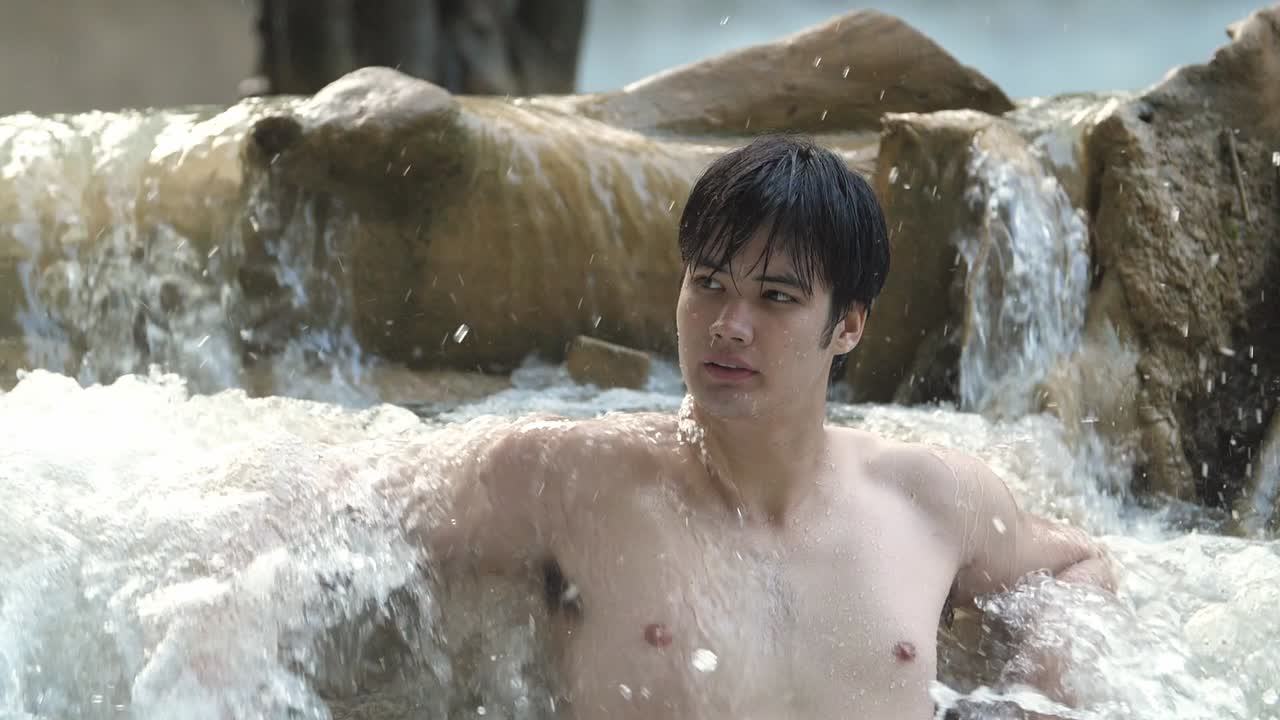 Sexy Man Relaxing In Nature Waterfall, Slow Motion