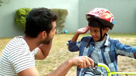 Father-and-son-giving-high-five-to-each-other