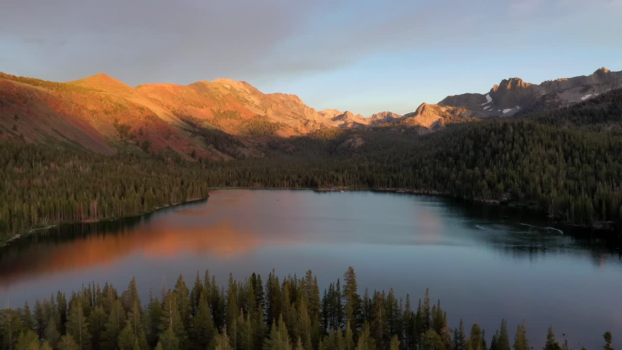 Sunset Sky Reflecting On The Water At Lake Tahoe In The Sierra Nevada Mountains, USA - aerial drone shot