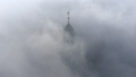 Aerial-view-of-Wawel-Castle-during-foggy-sunrise,-Krakow,-Poland