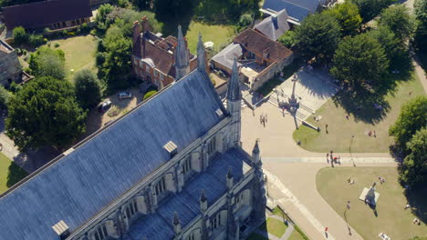 lowering drone shot over winchester cathedral and grounds, captured during summer in hampshire, uk