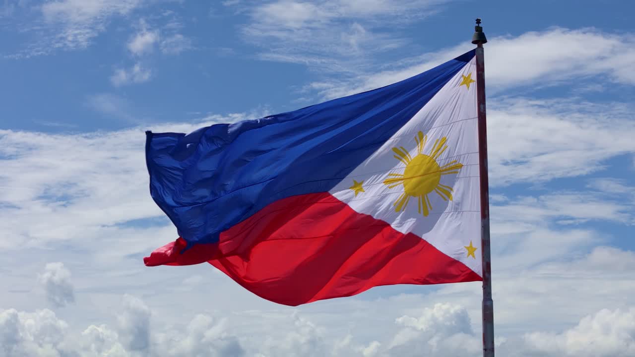 National Philippine Flag Flying High Under Midday Clear Sky
