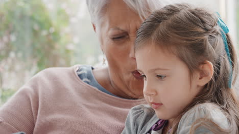 little-girl-showing-grandmother-how-to-use-smartphone-teaching-granny-modern-technology-intelligent-child-helping-grandma-with-mobile-phone-at-home-4k