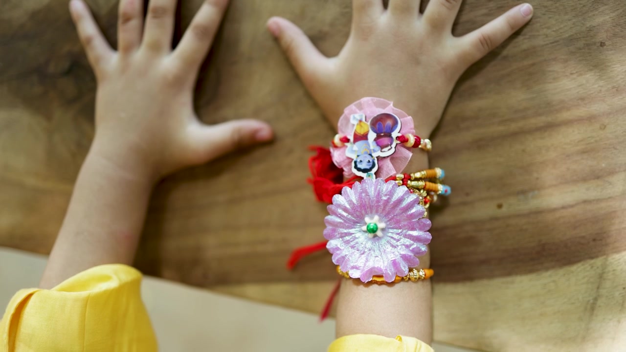 decorative rakhi thread on little boy wrist during indian sibling festival