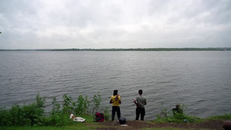 two fishermen fishing by the ambazari lake