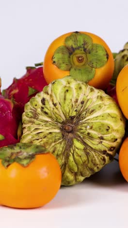 dragon fruit and persimmons artfully arranged