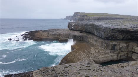 rough ireland coastline by inis mor wormhole, aerial drone view